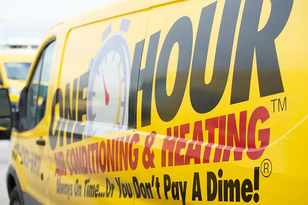 One Hour Air Conditioning & Heating branded service van displaying company logo and slogan